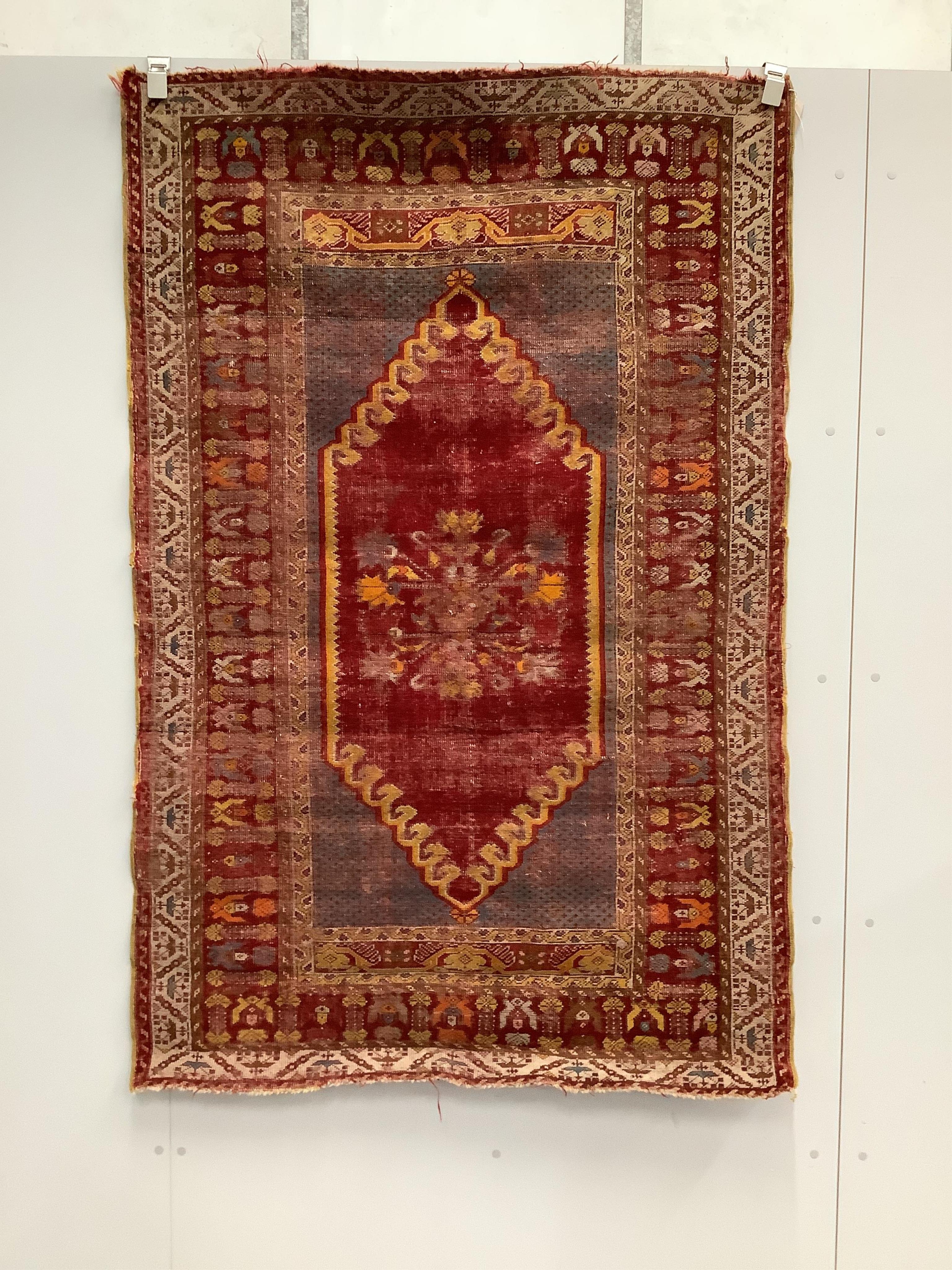 An antique hand knotted Caucasian blue ground prayer rug, 180 x 117cm